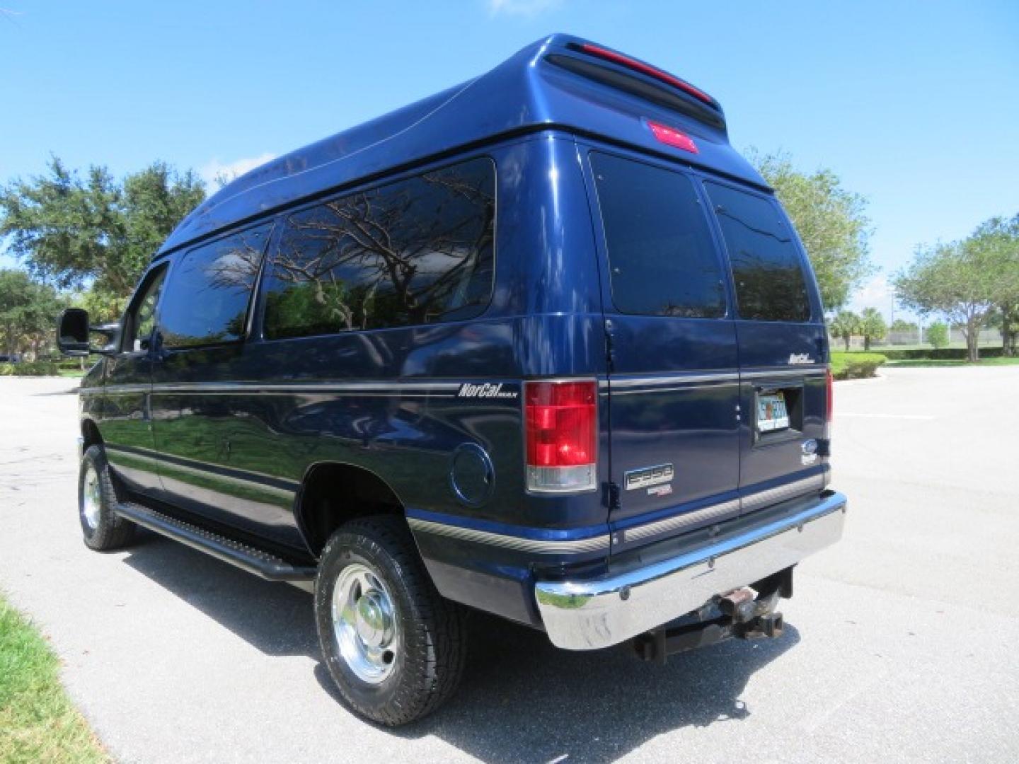 2011 Dark Blue /Gray Ford E-Series Wagon E-350 XLT Super Duty (1FBNE3BS4BD) with an 6.8L V10 SOHC 20V engine, located at 4301 Oak Circle #19, Boca Raton, FL, 33431, (954) 561-2499, 26.388861, -80.084038 - You are looking at a Gorgeous 2011 Ford Econoline E350 XLT Norcal Max High Top Handicap Wheelchair Conversion Van with 6.8L V10, 15K Original Miles, 9 Inch Lowered Floor, Braun UVL Side Entry Wheelchair Lift, Remote Control Power Side Entry Doors, Expanded Side Entry Doors, Q Straint Tie Down, Syste - Photo#12